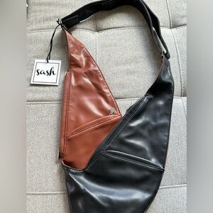 New with tags! Sash Faux Leather Black & Tan Hobo Bag.